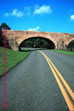 Stock Photo #1505: keywords -  arch blue bridge curve landscape masonry overpass parkway pavement remote ridge road route rural scenic solitary stone street stripe tunnel vert virginia wild winding