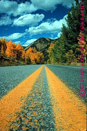 Stock Photo #1510: keywords -  aspen autumn closeup colorado country countryside fall foliage landscape mountain orange remote road route rural scenic street stripe vert