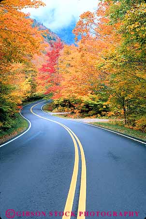 Stock Photo #16089: keywords -  autumn color curve curved curves curving curvy double england fall foliage highway highways hill hills hilly hwy in landscape maple new pavement region road roads route routes scenery scenic season stowe street streets transport transportation travel tree trees vermont vert winding yellow