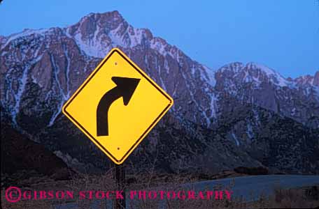 Stock Photo #1546: keywords -  arrow caution curve driving highway horz road safety sign slow square street traffic warning yellow