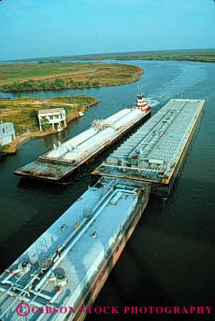 Stock Photo #6185: keywords -  barge barges boat canal commerce industry intercoastal push river ship shipping texas transport transportation transporting tugboat vert water waterway work