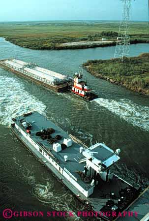 Stock Photo #6186: keywords -  barge barges boat canal commerce industry intercoastal push river ship shipping texas transport transportation transporting tugboat vert water waterway work