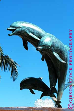 Stock Photo #1586: keywords -  animal jump leap mammal metal porpoise sculpture sky statue vert weathered