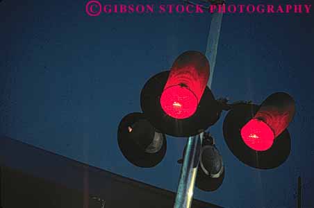 Stock Photo #1612: keywords -  bright colorful crossing danger horz light passing railroad red stop train transportation warning