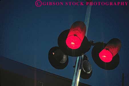 Stock Photo #1612: keywords - bright colorful crossing danger horz light passing railroad red stop train transportation warning