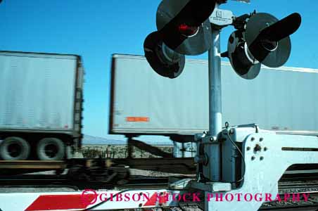 Stock Photo #1613: keywords -  bright colorful crossing danger freight gate horz industry light passing railroad stop train transportation warning