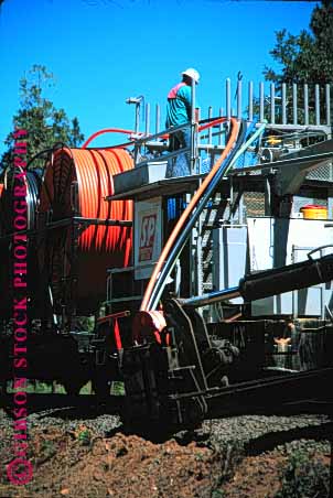 Stock Photo #1628: keywords -  bury cable communications dig equipment fiber heavy industry machine optic plastic railroad spool technology track train vert wire