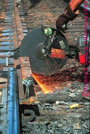 Stock Photo #1631: keywords -  cut hot industry maintenance power rail railroad repair saw sparks track train vert work