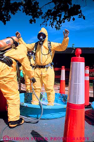 Stock Photo #12539: keywords - bright caution clean cleaning contain containment contaminated contaminates contamination crew danger dangerous decontaminate decontaminates decontaminating decontamination emergencies emergency equipment fireman firemen haz hazard hazardous hazmat in job jobs line mat material materials mats member occupation people poison poisonous protect protecting protection protective protects public respond responding responds response rinse rinsing risk safety substance substances suit synthetic team teams toxic vert wash washes work worker workers working works yellow