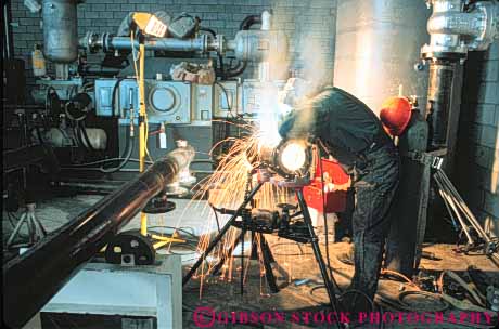 Stock Photo #10939: keywords - air arc arcs burn clothing cloths construction danger dangerous environment environmental equipment fabricate fabrication factory fitter grinding hardware hazard hazardous hazards health heat horz hot in industrial industry job jobs labor laborer machine machinist man manufacture manufacturing occupation occupational occupations pipe pollute polluted pollutes pollution protect protection protects risk risky safe safety site skill skilled smoke spark sparking sparks streak streaked streaks torch weld welder welders welding welds work worker workers working works