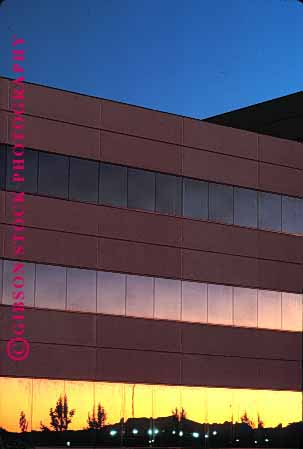 Stock Photo #1669: keywords -  architecture building business commerce design geometric low modern office reflection rise sunrise sunset vert windows