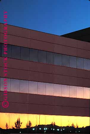 Stock Photo #1669: keywords -  architecture building business commerce design geometric low modern office reflection rise sunrise sunset vert windows