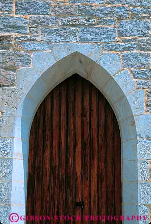 Stock Photo #16373: keywords - arch arches architectural architecture building buildings craftsmanship design designed designs door doors doorway fit fits keystone masonry opening openings rock rocks stone stones style styled styles vert wall walls with