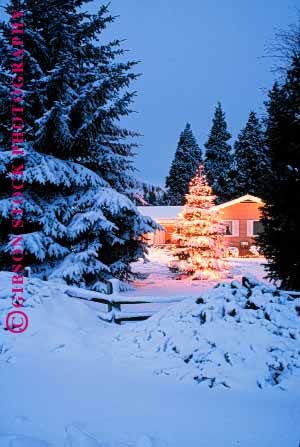 Stock Photo #1723: keywords -  christmas decoration dusk evening holiday home house lighting property released snow sunset tree vert winter