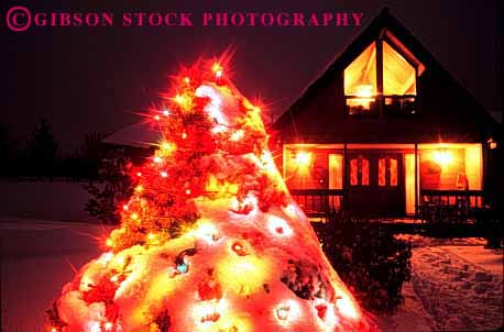 Stock Photo #1725: keywords -  christmas decoration dusk evening holiday home horz house lighting property released snow sunset tree winter