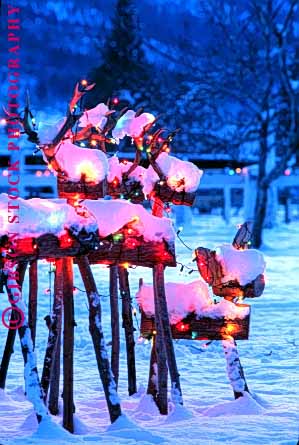 Stock Photo #1726: keywords -  animal christmas decoration dusk evening holiday imitation lighting model reindeer released snow vert winter wood