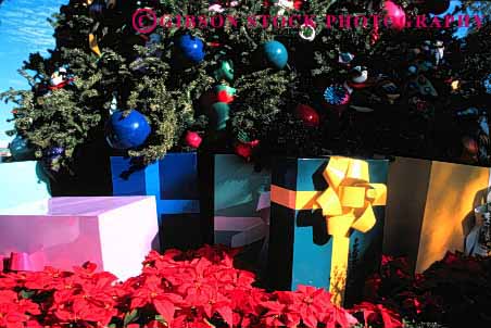Stock Photo #1738: keywords -  celebrate christmas colorful decorate gift giving holiday horz ornament outdoor package presents share tree under