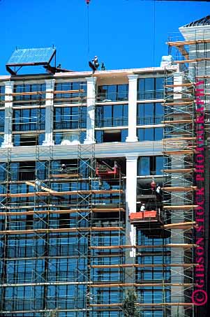 Stock Photo #1739: keywords -  building construction crane danger industry men risk scaffold steel vert window work