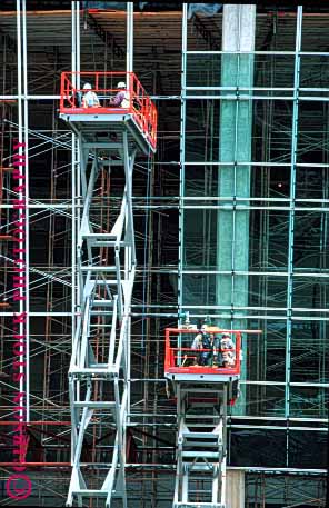 Stock Photo #1742: keywords -  building construction danger industry install lift men risk scaffold scissors steel vert window work