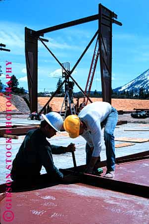 Stock Photo #1743: keywords -  beam building concrete construction danger frame hardhat industry men risk steel vert work