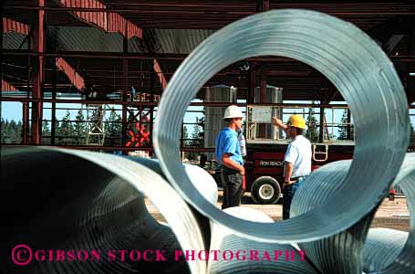 Stock Photo #1746: keywords - building circle construction duct hardhat horz industry job men model pipe released round steel talk work
