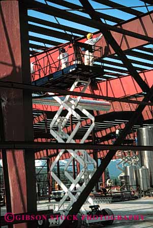 Stock Photo #6183: keywords -  build career commercial construction elevate equipment hydraulic industrial job lift machine men metal occupation paint risk scissors steel up vert vocation work workers