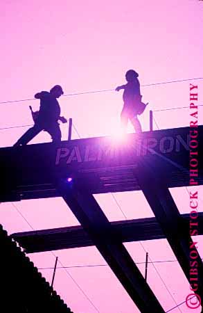 Stock Photo #1749: keywords - balance building commercial construct constructing construction constructs danger fall high iron job men metal occupational risk silhouette silhouettes silouette steel vert work workers