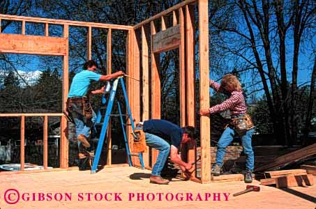 Stock Photo #1755: keywords -  carpenters construction cooperate frame home horz house ladd lift men model new raise released team wall woman