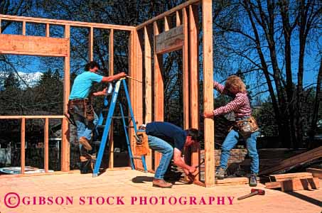 Stock Photo #1755: keywords - carpenters construction cooperate frame home horz house ladd lift men model new raise released team wall woman
