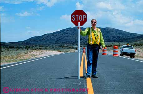 Stock Photo #6104: keywords -  career construction control countryside direction flag flagman girl hexagon highway horz income job occupation outdoor outside released remote road rural safety sign stop street traffic vocation woman work worker young