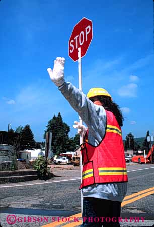 Stock Photo #6038: keywords -  career construction control female gesture glove hand hardhat job occupation road safety signal stop symbol traffic vert vest woman work worker