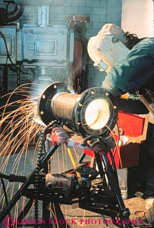 Stock Photo #10940: keywords - air arc arcs burn clothing cloths construction danger dangerous environment environmental equipment fabricate fabrication factory fitter grinding hardware hazard hazardous hazards health heat hot in industrial industry job jobs labor laborer machine machinist man manufacture manufacturing occupation occupational occupations pipe pollute polluted pollutes pollution protect protection protects risk risky safe safety site skill skilled smoke spark sparking sparks streak streaked streaks torch vert weld welder welders welding welds work worker workers working works