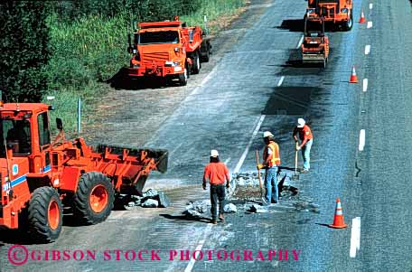 Stock Photo #1767: keywords -  cal construction cooperate crew dig equipment highway horz interstate job machine maintenance men orange pavement repair road street team trans work