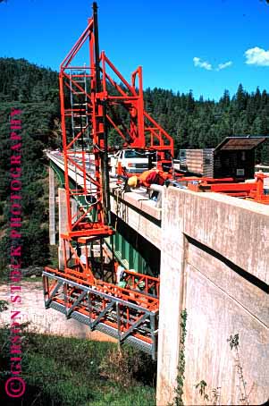 Stock Photo #1772: keywords -  bridge cal construction cooperate crew equipment highway job machine maintenance men orange pavement repair road scaffold street team trans vert work