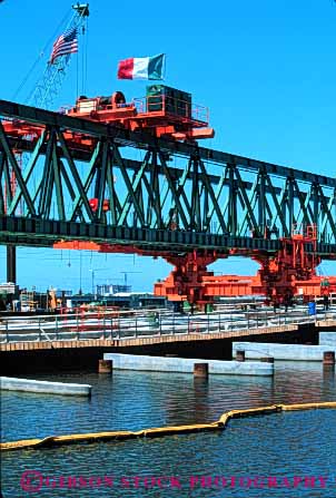 Stock Photo #6181: keywords -  american bridge clean construction crane equipment flag gantry geometric geometrical green heavy industry italian mobile new orange shiny symmetrical symmetry vert water