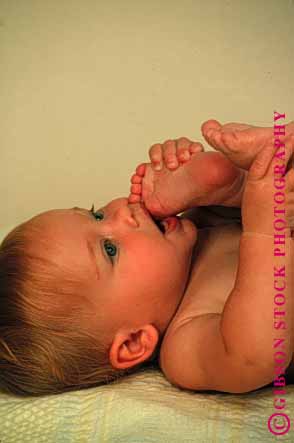 Stock Photo #1788: keywords -  baby chew child cute feet infant model play released toe vert