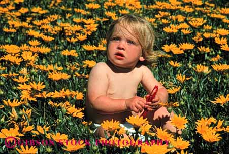 Stock Photo #1791: keywords -  baby child cute flowers horz in infant model nature outdoor play released yellow