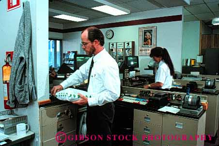 Stock Photo #1810: keywords -  career carrier clerks communicate counter customer deliver employee front horz income industry job jobs letter letters mail occupation office organize organizes organizing package parcel people person post postal released sale service shipping sort sorter sorts stamp work