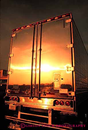 Stock Photo #1825: keywords -  bright clean commerce dawn industry park reflection shiny shipping sunrise sunset transportation truck trucking vert warm