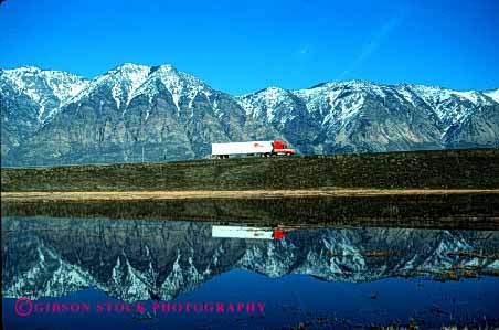 Stock Photo #1839: keywords -  commerce highway highways horz image industry interstate lake landscape like mirror mountains reflecting reflection scenery scenic shipping snow transportation truck trucking trucks utah water winter