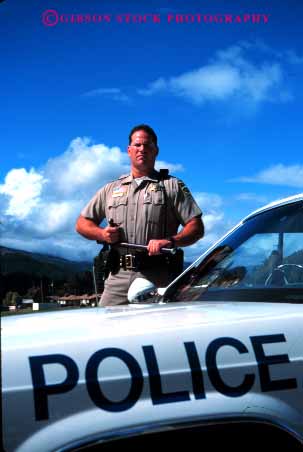 Stock Photo #1841: keywords -  baton car danger income job mean model occupation patrol policeman pose public released risk service stern stick summer tough uniform vert work