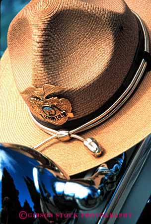 Stock Photo #1842: keywords -  brim broad clothes gold handsome hat policeman symbol vert