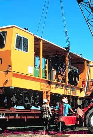 Stock Photo #3404: keywords -  big california car crane cranes dangerous equipment heavy huge industrial industry joaquine large lift lifting lifts machine machines man men people person power powerful railroad railroads san strong train trains up upward upwards valley vert weight yellow