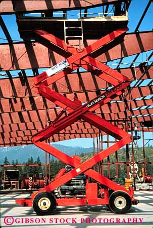 Stock Photo #1851: keywords -  beam building construction crisscross geometric geometry hydraulic industry lift red scissors steel vert