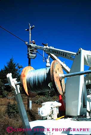 Stock Photo #1852: keywords -  cable cherry construction energy equipment heavy hydraulic industry job lift men picker pole spool truck utility vert work