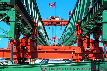 Stock Photo #6098: keywords -  brace bracing bridge build building built clean construction crane equipment frame gantry green heavy hoist horz industry lift lifting metal new orange paint