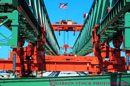 Stock Photo #6098: keywords -  brace bracing bridge build building built clean construction crane equipment frame gantry green heavy hoist horz industry lift lifting metal new orange paint