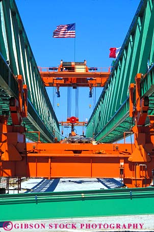 Stock Photo #6180: keywords -  american bridge clean construction crane equipment flag gantry geometric geometrical green heavy horz industry mobile new orange shiny symmetrical symmetry