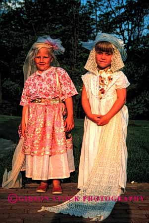 Stock Photo #1881: keywords - children clothes clothing costume costumed costumes cute daycare dress dresses friend friends frienship girl girls in kid kids pair play playing plays pose pretend pretending pretends released together two up vert womans