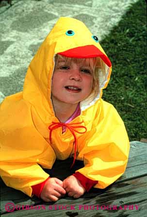 Stock Photo #1884: keywords - child coat cute girl model outdoor play rain released vert weather yellow